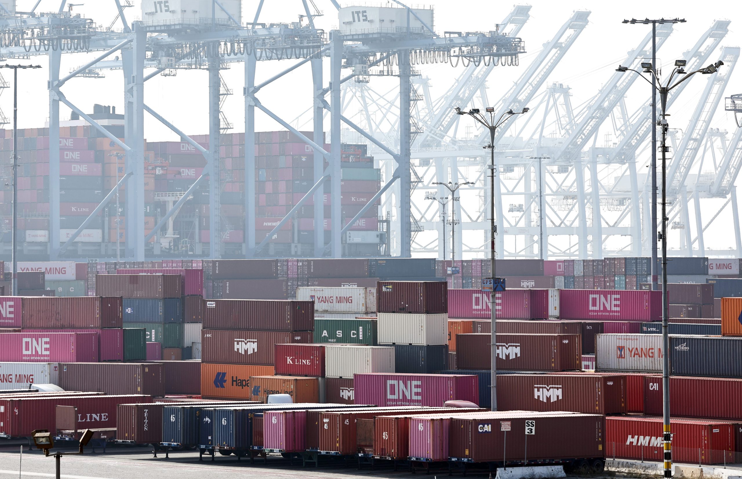 LONG BEACH, CALIFORNIA - DECEMBER 04: Shipping containers are stacked beneath shipping cranes at the Port of Long Beach on December 4, 2024 in Long Beach, California. U.S. President-elect Donald Trump is threatening new tariffs on multiple countries as his second term approaches after making tariffs a signature of his 2024 Presidential campaign. The ports of Los Angeles and neighboring Long Beach is the country’s busiest container port complex. (Photo by Mario Tama/Getty Images)