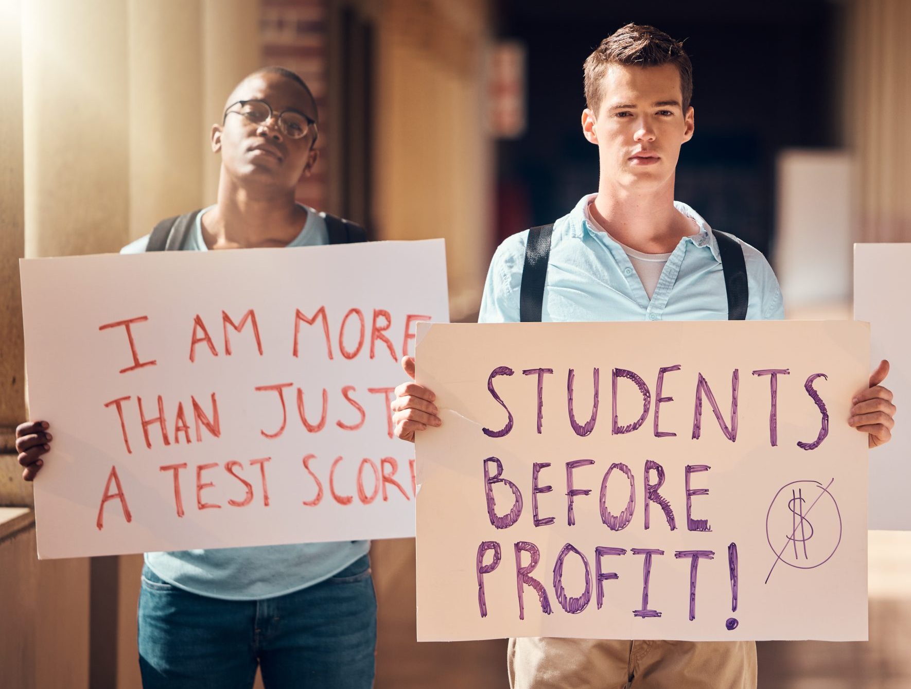 Students, protest and billboards for education at university for voice, sign or message at the campus. Student group protesting or strike with posters at school for better treatment, learning or care