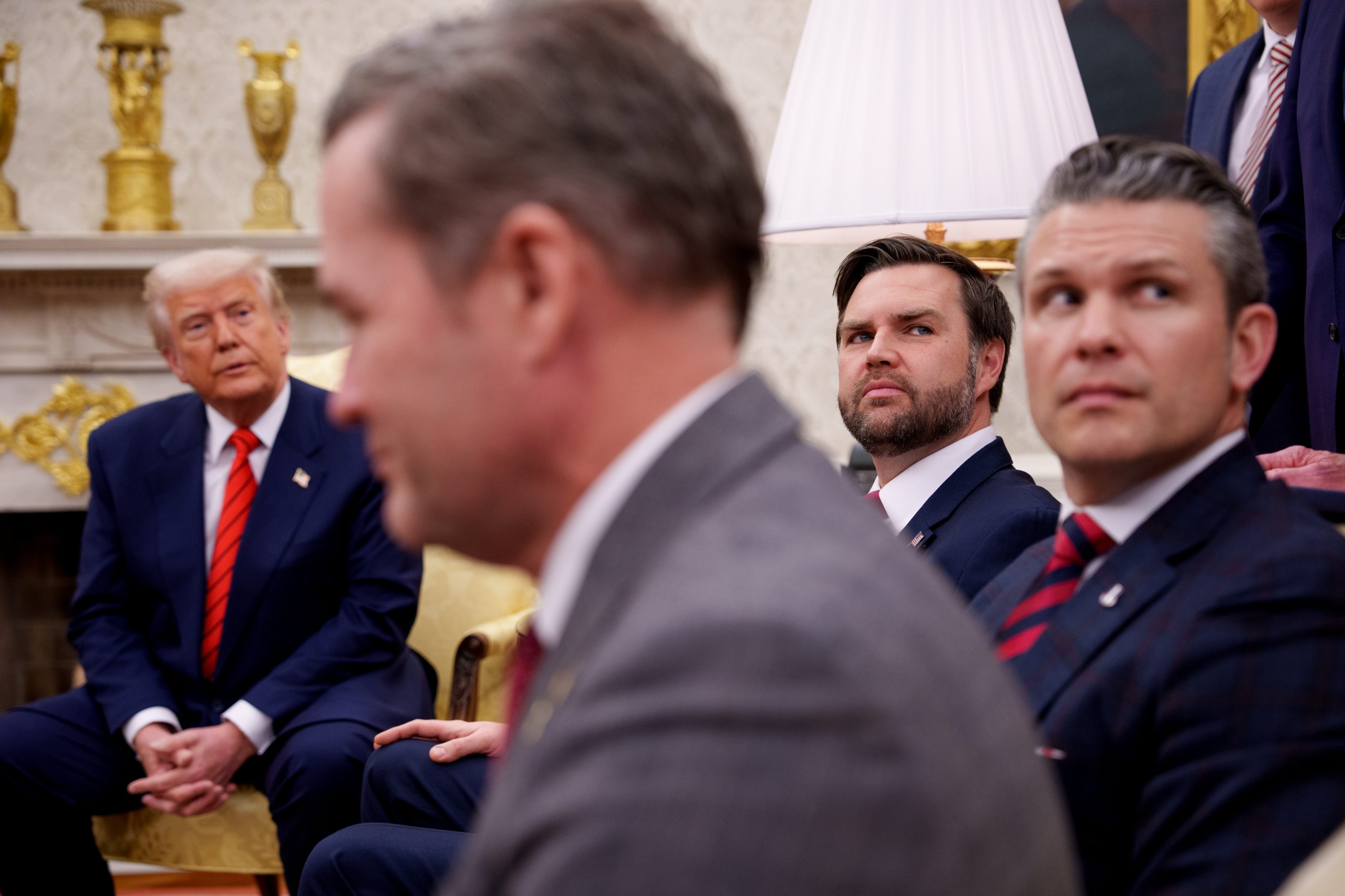 WASHINGTON, DC - MARCH 13: (L-R) U.S. President Donald Trump, U.S. National Security Adviser Michael Waltz, U.S. Vice President J.D. Vance, and Defense Secretary Pete Hegseth, listen to a question from a reporter during a meeting in the Oval Office of the White House on March 13, 2025 in Washington, DC. The two leaders met as the Trump administration has once again put the military alliance between the United States and Western Europe in question. (Photo by Andrew Harnik/Getty Images)