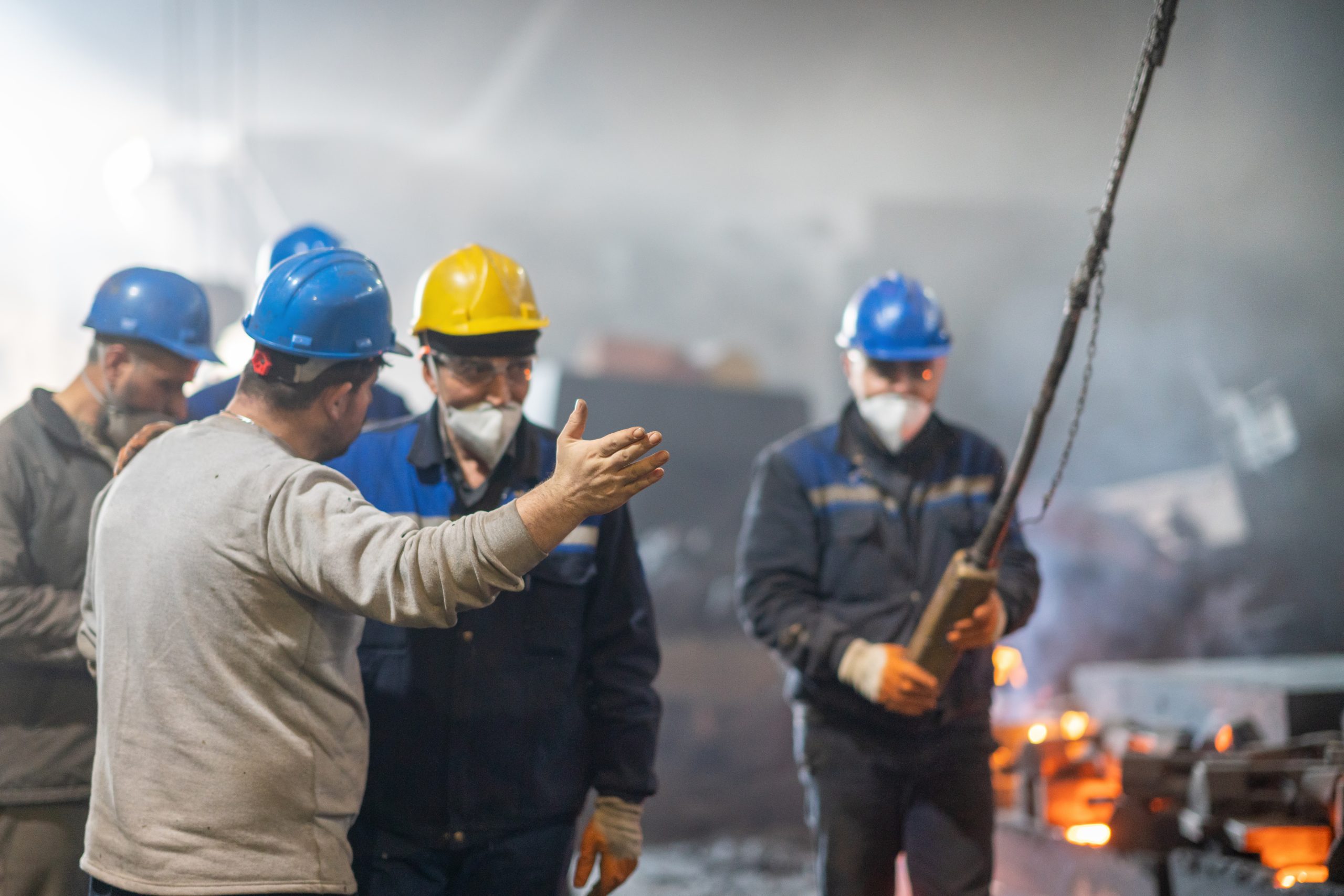 Workers discussing inside factory