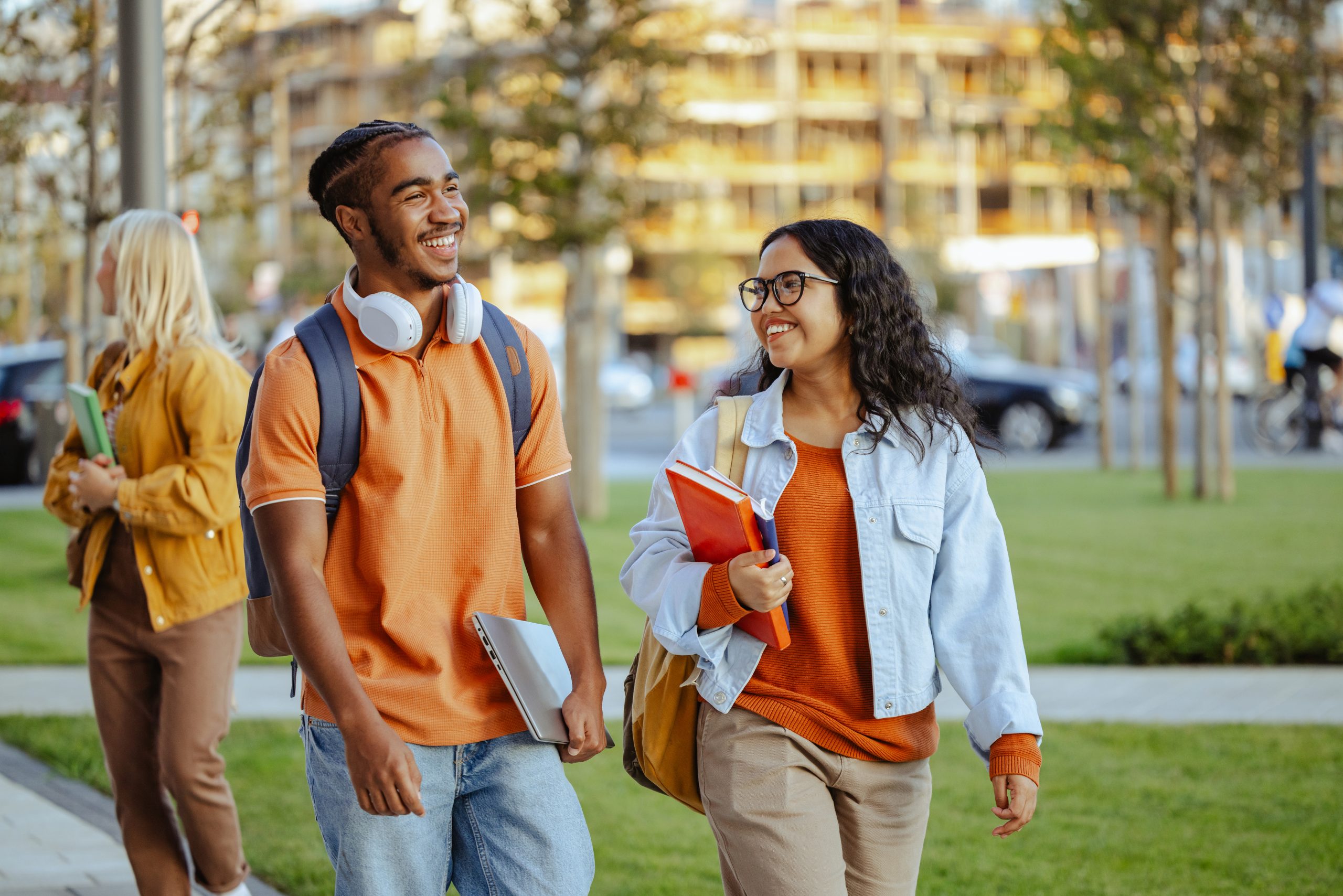 Diverse Students in university campus. Male and female student chatting on the street