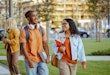 Diverse Students in university campus. Male and female student chatting on the street