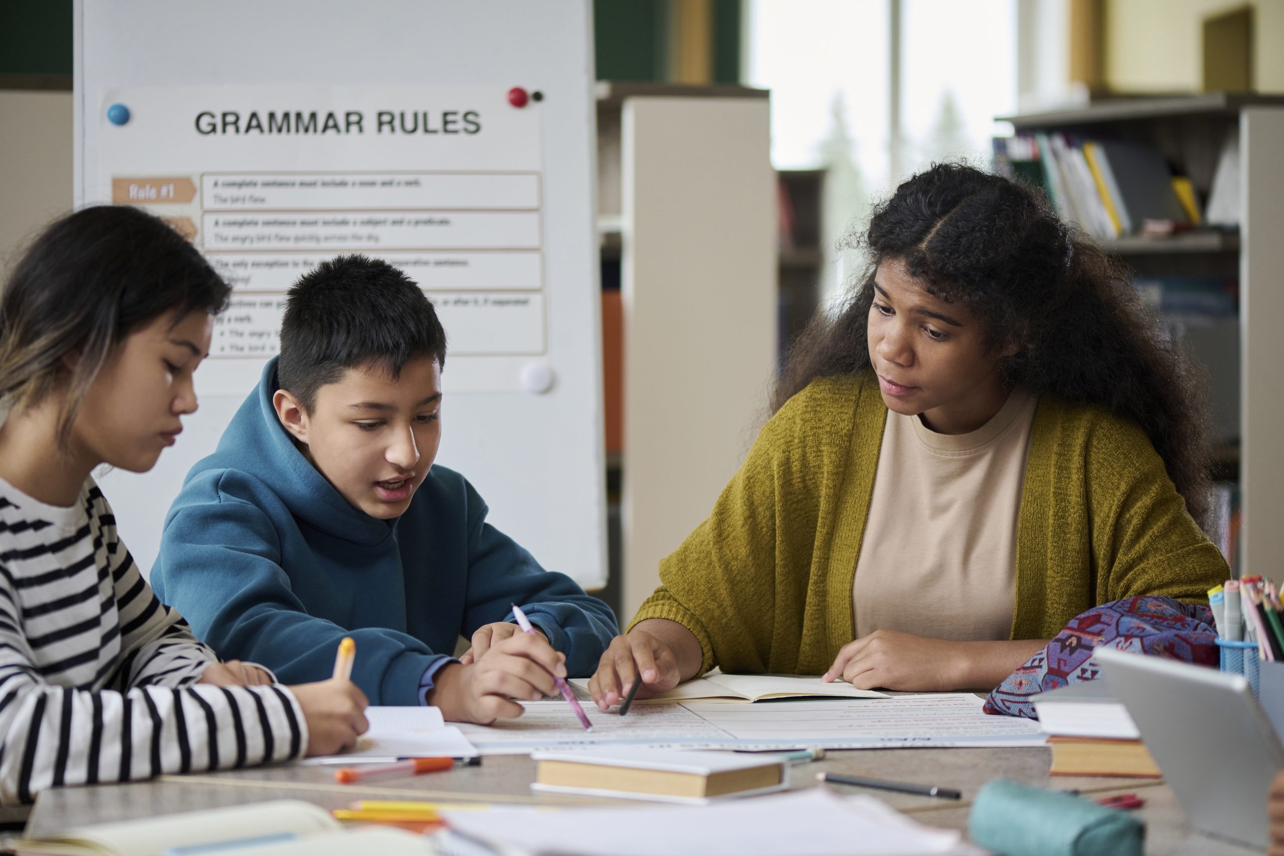 Intercultural children studying together in a classroom setting