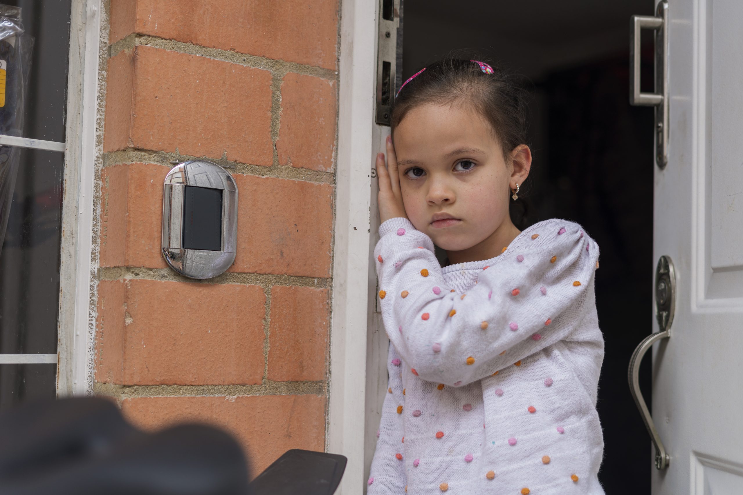 Cropped close up portrait of serious sad little girl looking at camera, unhappy little orphan girl feeling lonely abandoned, outcast or lonely miss parents, childhood drama, volunteer concept
