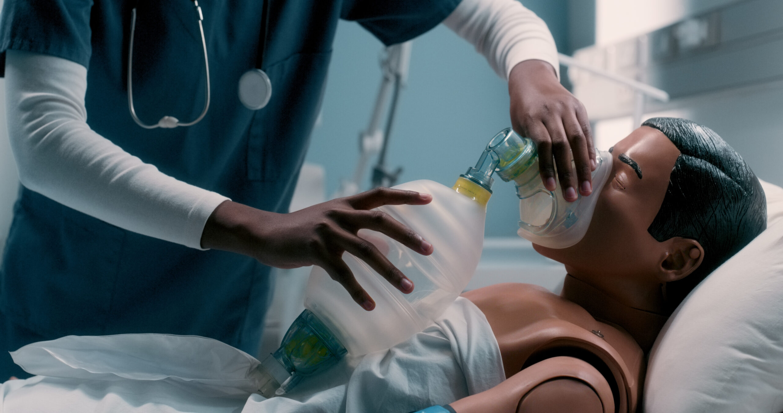 Resuscitator bag, clinic and doctor with dummy for learning emergency ventilation at medical internship. Healthcare, hospital and nursing student with doll for cpr training with manual oxygen mask.