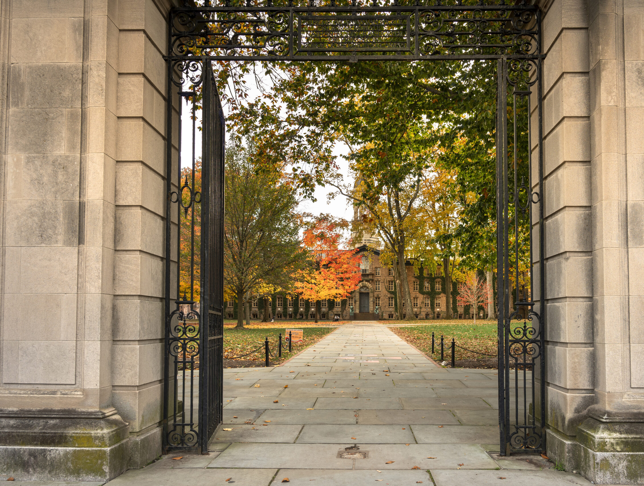 Princeton, New Jersey - October 28, 2022:  Entrance to Nassau Hall by the dormitories on the campus of the Ivy League university of Princeton.  Founded in 1746, the school is known for its engineering, science and humanities programs.